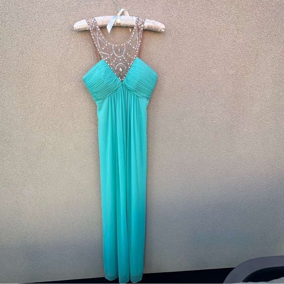 Beautiful long dress
In Aqua blue. - Picture 7 of 7
